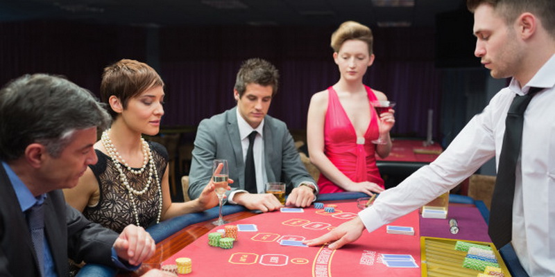 Four people playing poker